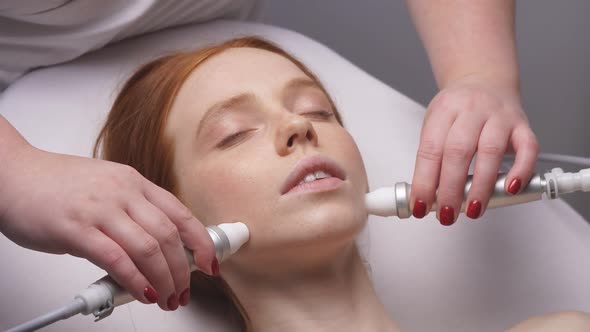 Young Woman in the Cosmetologist's Office Will Receive the Facial Skin Rejuvenation Procedure