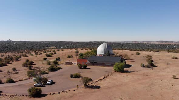 DRONE Drop Down Shot of a Observatory in a Nature Reserve on a Sunny Day alt