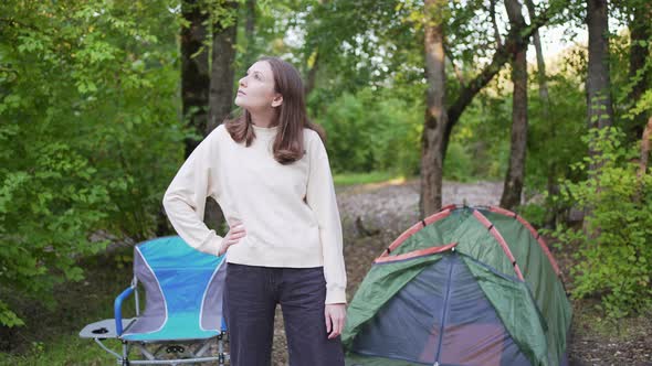 A Lonely Woman Enjoys a Holiday in the Forest with a Tent