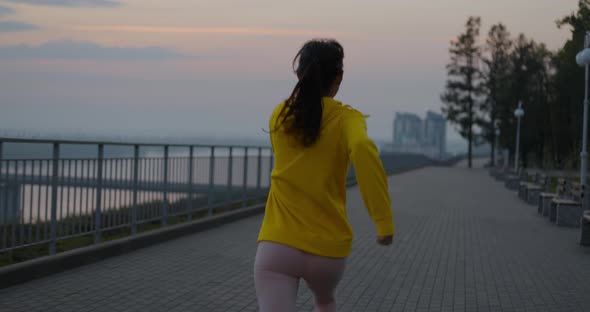 Young Woman Running In The Park alt