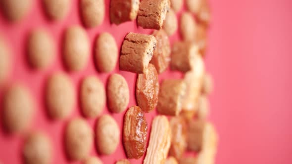 Vertical video, Close-up: puff pastry biscuits rotate on a stand in a glass cloche alt