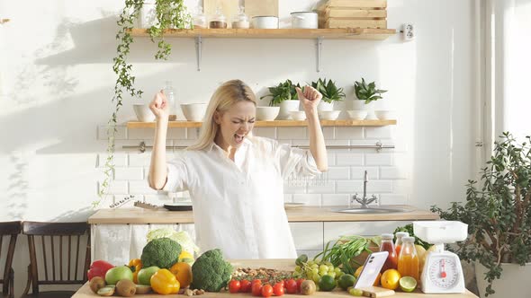Beautiful Blogger Woman in a White Casual Shirt is Enjoying a Healthy Diet She is Dancing with