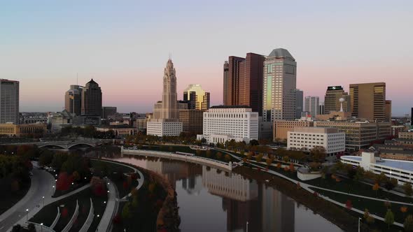 Columbus Ohio Skyline at dusk with the Scioto River in the foreground alt