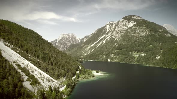 Aerial view of lake with green water near the Cave del Predil, Itally. alt