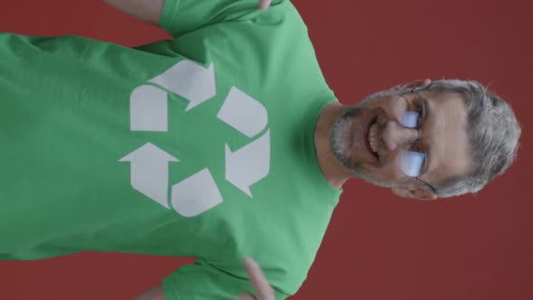 Man Pointing at Recycling Symbol on T-shirt alt
