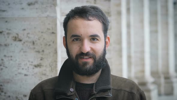 Confident attractive young man looking alt