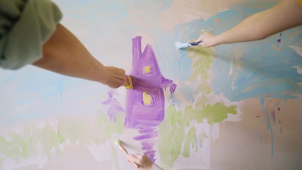 People Hands Draw Purple Building and Blue Sky on Wall