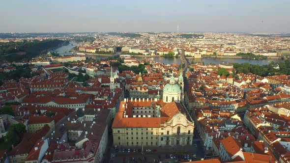 Aerial of St. Nicholas Church and Vltava River alt