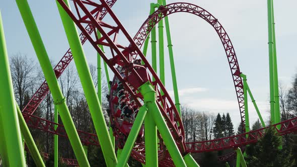 roller coaster in the park, people relax and have fun on the weekend alt