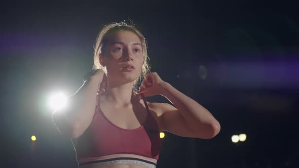 Slow Motion Woman Preparing for the Race in the Track and Field Race alt