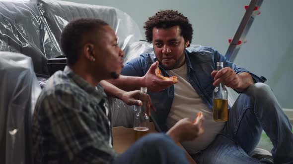 Black Builders Eat Pizza with Beer Tell Jokes Sit on Floor alt