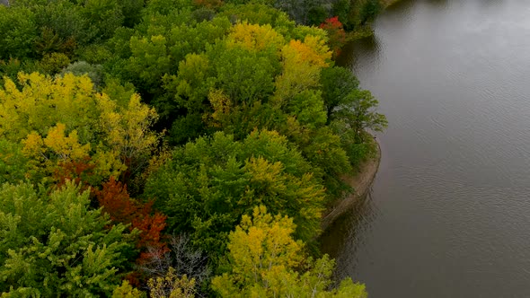 4K camera drone captures fall season colors during flight over the Montreal suburbs in Canada.