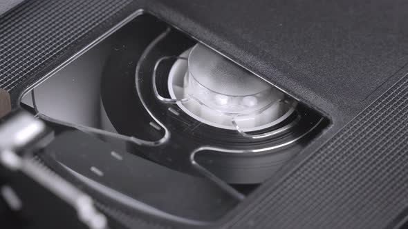 VHS video cassette inserting in the VCR, play, stop, eject