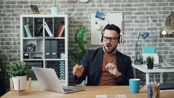 Joyful Person Office Worker Listening To Music Dancing Having Fun at Work alt