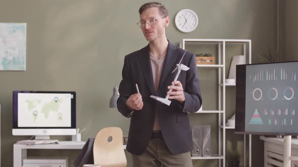 Man Making Presentation on Alternative Energy Project in Office alt