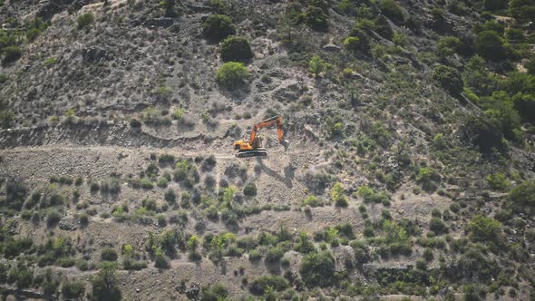 Digger Work Mine in Rocky Ground on Mountain Wilderness Area in Troodos Cyprus alt