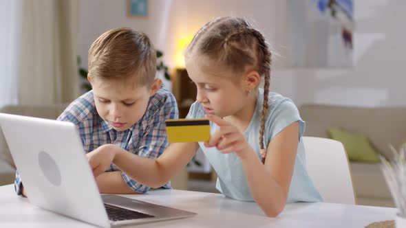 Boy and Girl Shopping Online Together alt