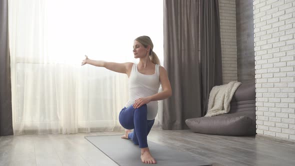 Attractive Pregnant Lady a Woman in Sports Clothes Does Yoga and Fitness for Pregnant Women Sitting