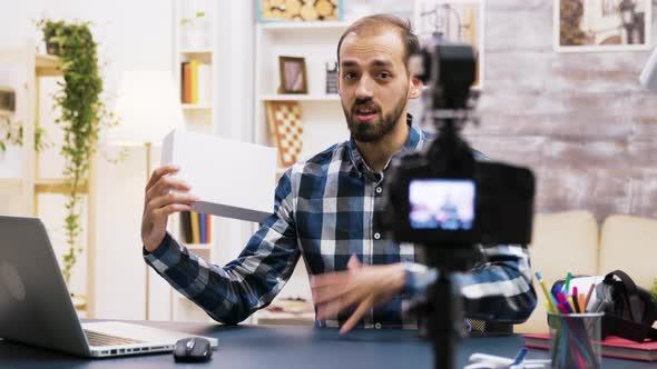 Excited Young Vlogger Making a Review of a Product alt