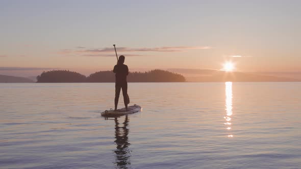 Adventurous Caucasian Adult Woman on a Stand Up Paddle Board alt