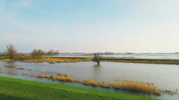 Fields and rivers, water stretching across designated flood areas.