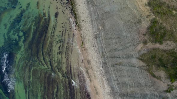 bird's eye drone view on a deserted beach alt