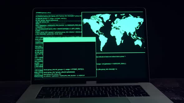 Hacker Concept. Code On A Laptop Computer Monitor In A Dark Room alt
