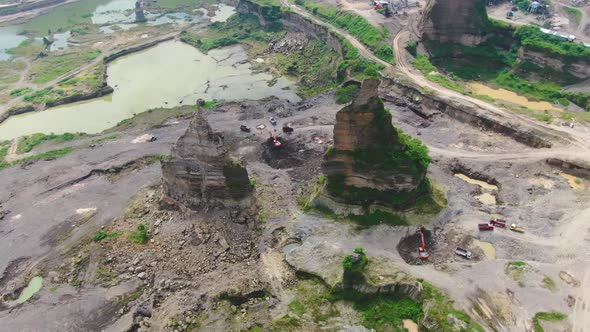 Aerial, machinery work in opencast sand mine Brown Canyon in Semarang Indonesia alt