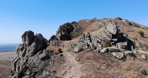 Pile Of Large Rocks Over Mountains Of Macin In Tulcea County, Dobrogea, Romania. Aerial Drone alt