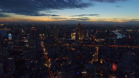 4k Aerial city view of Bangkok dowtnown, Flying over Bangkok, Thailand. alt