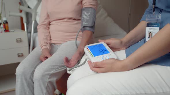 Detail of Automatic Arm Blood Pressure Monitor With High Blood Pressure on Blue Display