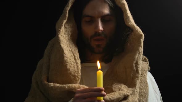 Crying Jesus in Robe Blowing Candle, Suffering From People Sins, Son of God alt