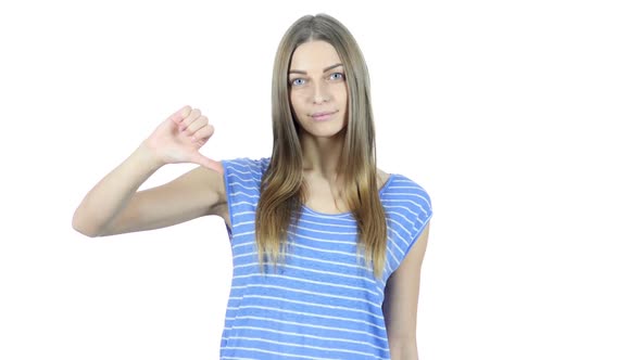 Thumbs Down By Beautiful Young  Woman, White Background alt