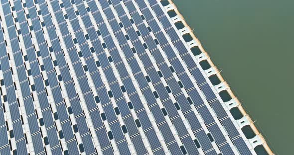 Aerial Top View of Electric Power Industry Solar Panels on Floating in Lake Water Renewable Energy alt