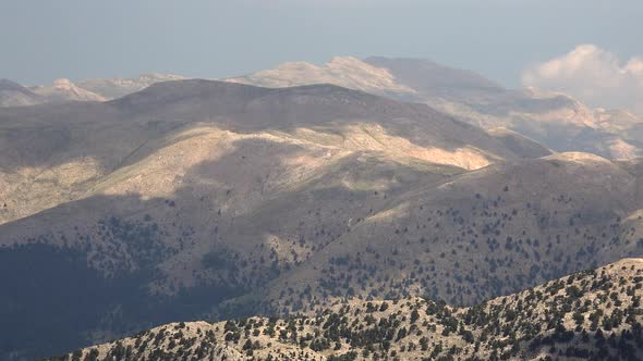 Cloud Shadows on Sparse Arid and Barren Mountain Slope alt