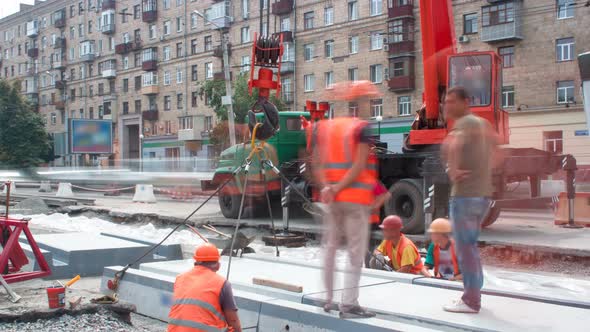 Installing Concrete Plates By Crane at Road Construction Site Timelapse. alt