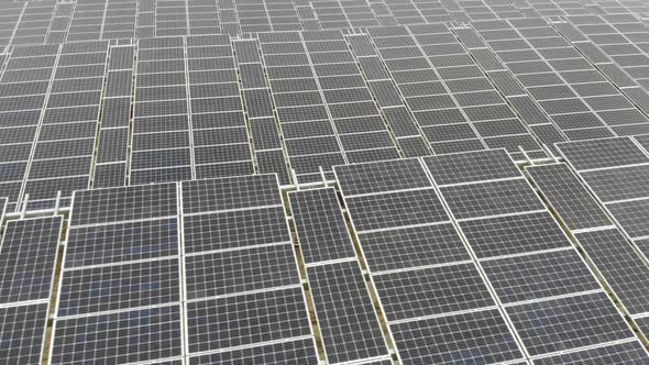 Aerial View Panorama of Solar Panels, Slow Movement of the Camera Over the Panels, Background alt
