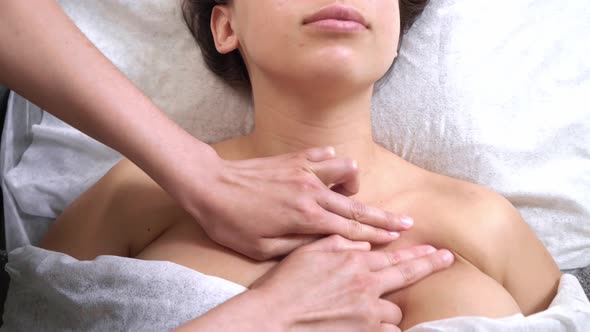 Spa Facial Massage. The Process of Sculpted Breast Massagein the Cosmetologist s Office. Beautiful