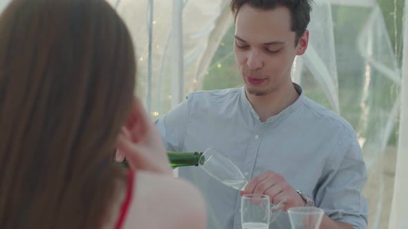 Young Couple Celebrates Anniversary with Champagne