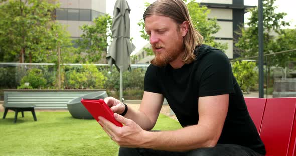 Man Reading An E Book