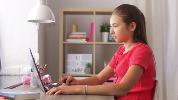 Student Girl with Laptop Computer Learning at Home alt