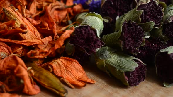 Flower teas on a wooden board alt