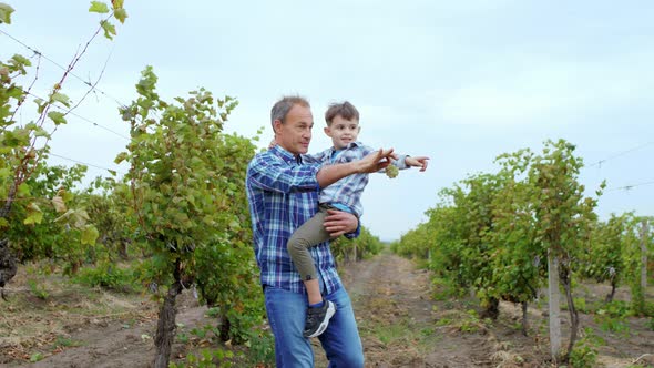 Happy and Charismatic Grandpa and His Cute with a alt