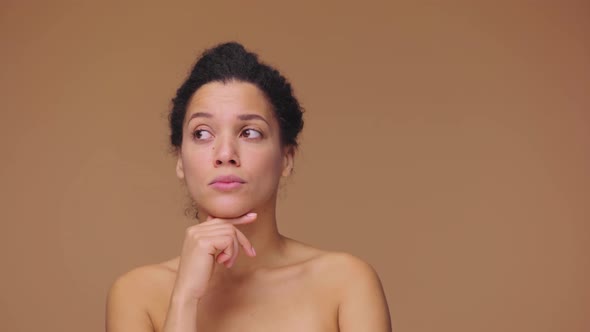 Beauty Portrait of Young African American Woman is Thinking About Something Rejoices an Idea Coming alt