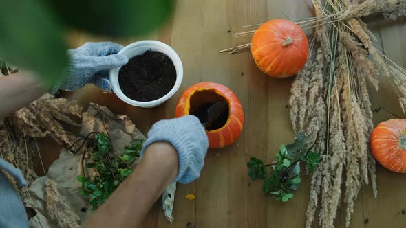 Woman Makes DIY Decoration for Thanksgiving Day Garden Decor alt