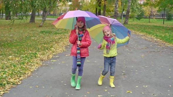 Girls with Umbrellas Singing and Dancing in Park alt