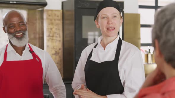 Chefs talking in the kitchen alt