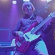 Guitarist Performs Solo Part on Electric Bass Guitar on Stage at Concert - VideoHive Item for Sale