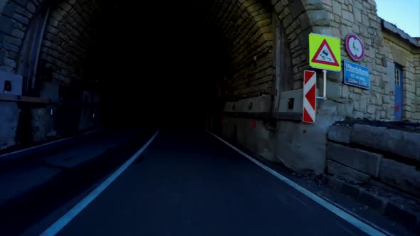 Driving across tunnel on the grossglockner road in the Alps alt