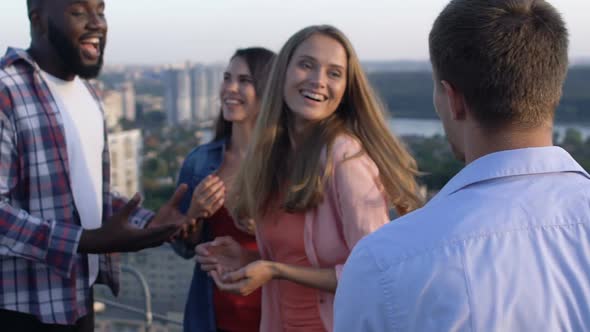 Cheerful Young Men and Women Talking and Hugging Slow-Mo, Roof Party on Weekend